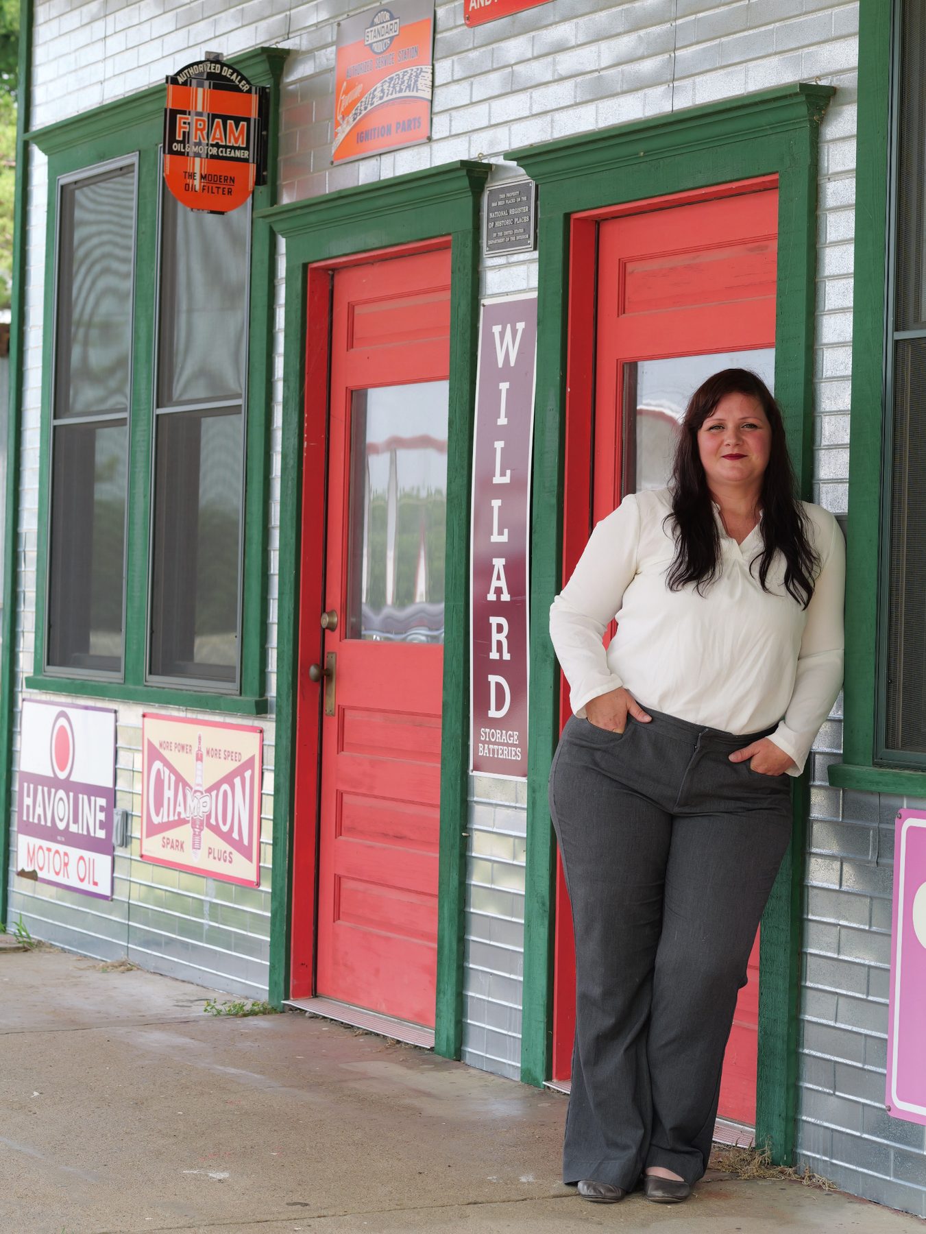 Amber Dawn Ellis standing by a historic Oklahoma storefront